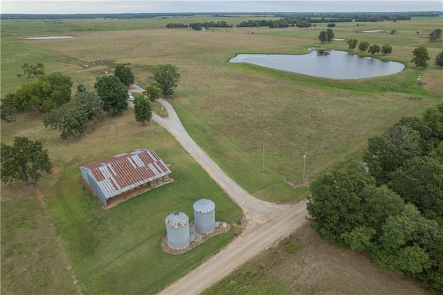 drone / aerial view featuring a water view and a rural view