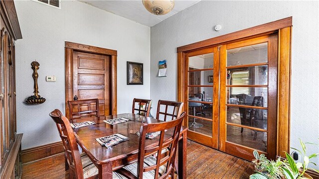 dining space featuring dark hardwood / wood-style flooring