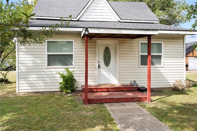 bungalow-style home featuring a front yard