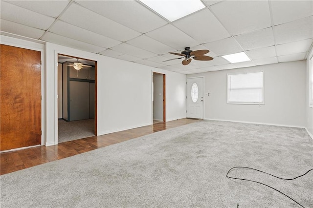 unfurnished room with hardwood / wood-style flooring, a paneled ceiling, and ceiling fan