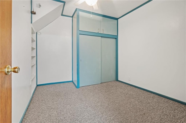 unfurnished bedroom featuring light carpet and ceiling fan