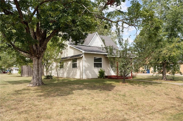 view of property exterior with a lawn