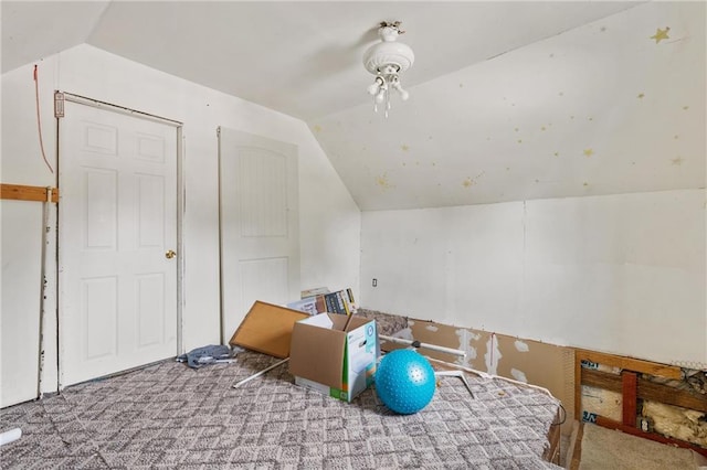 bonus room featuring lofted ceiling and carpet flooring