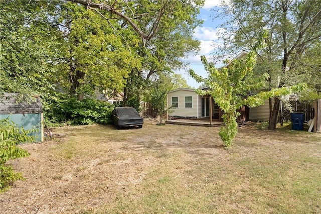 view of yard with a wooden deck