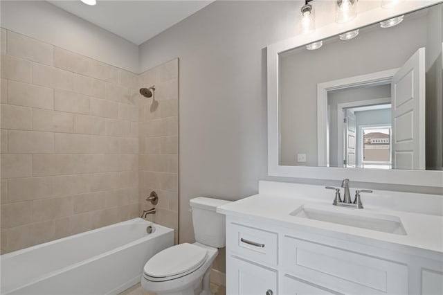 bathroom with shower / bathing tub combination, vanity, and toilet