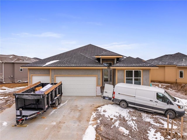 view of front of house with a garage and driveway