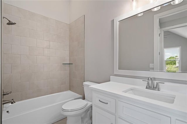 bathroom featuring toilet, shower / washtub combination, and vanity