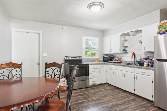 kitchen featuring white cabinets, backsplash, stainless steel appliances, and dark hardwood / wood-style flooring