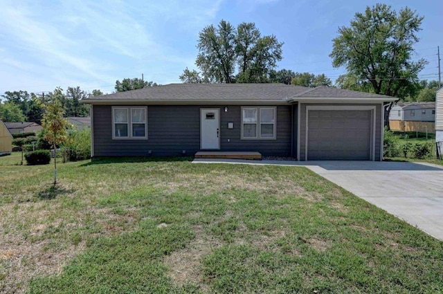 ranch-style home with a garage and a front lawn