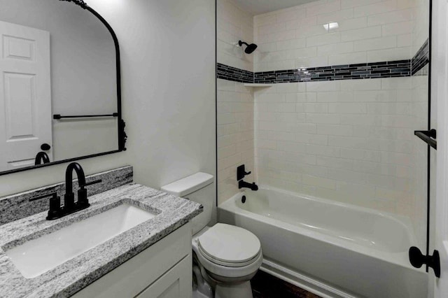 full bathroom with vanity, toilet, and tiled shower / bath combo