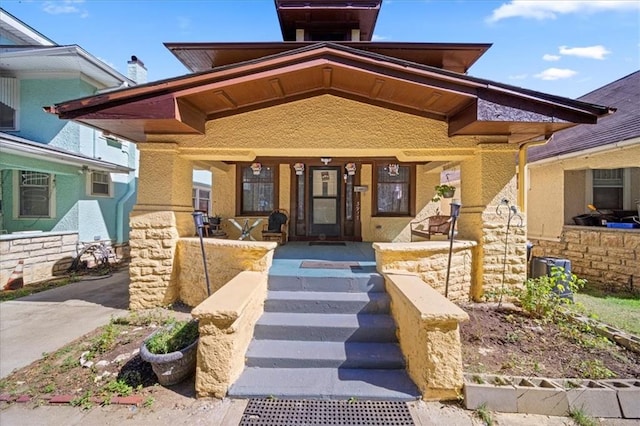 property entrance with covered porch