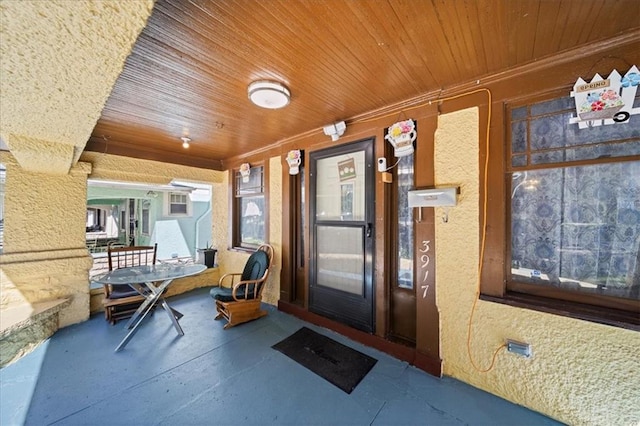 entrance to property featuring a porch