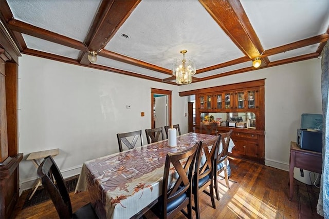 dining area with beam ceiling, a chandelier, and dark hardwood / wood-style flooring