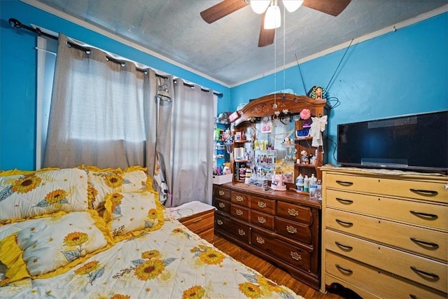 3917 Benton Blvd, Kansas City, MO 64130 - bedroom with wood finished floors and a ceiling fan