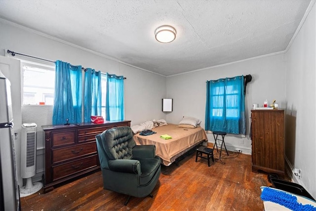 bedroom with a textured ceiling, crown molding, stainless steel fridge, and dark wood-type flooring