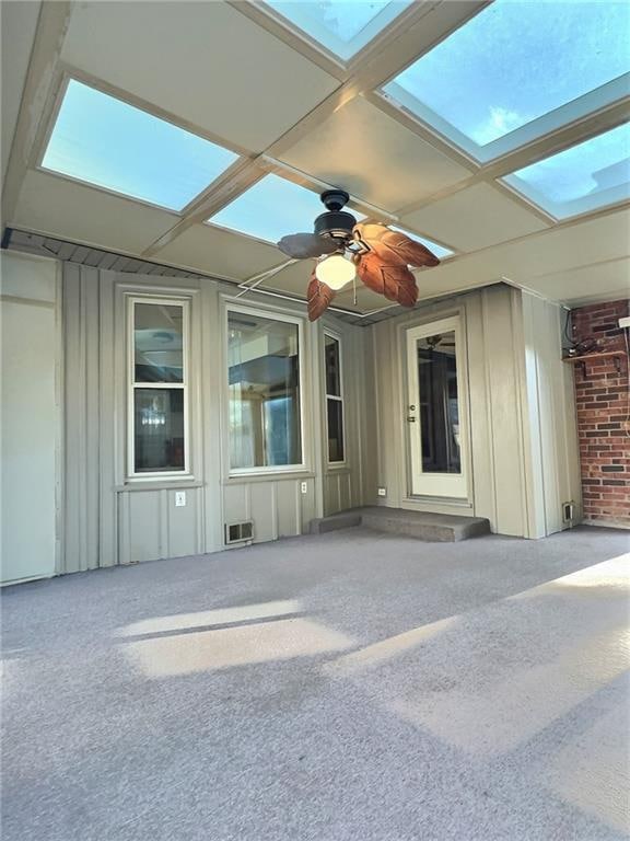 doorway to property featuring ceiling fan