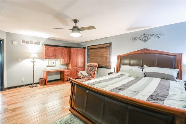 bedroom featuring light wood-type flooring, visible vents, ceiling fan, and baseboards