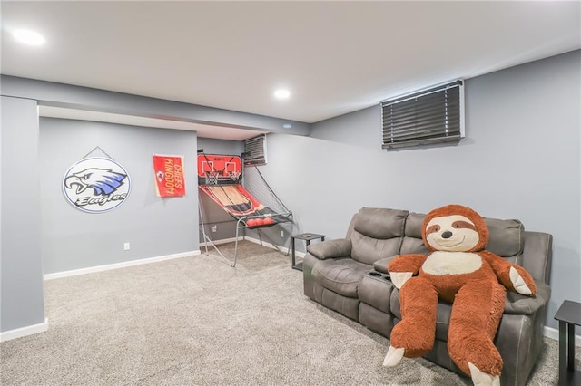 sitting room featuring carpet, baseboards, and recessed lighting