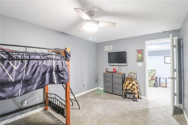 bedroom featuring a ceiling fan, carpet flooring, visible vents, and baseboards