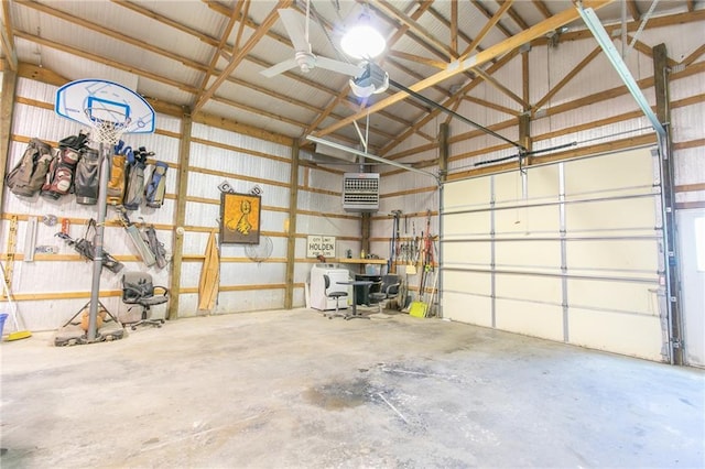 garage with metal wall and a garage door opener