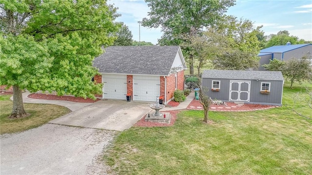 view of front of house with a garage, roof with shingles, an outdoor structure, a front lawn, and brick siding