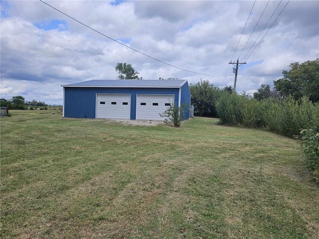 view of outbuilding featuring a yard and a garage