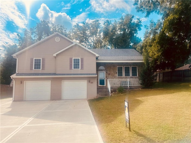 view of front of house with a garage and a front yard