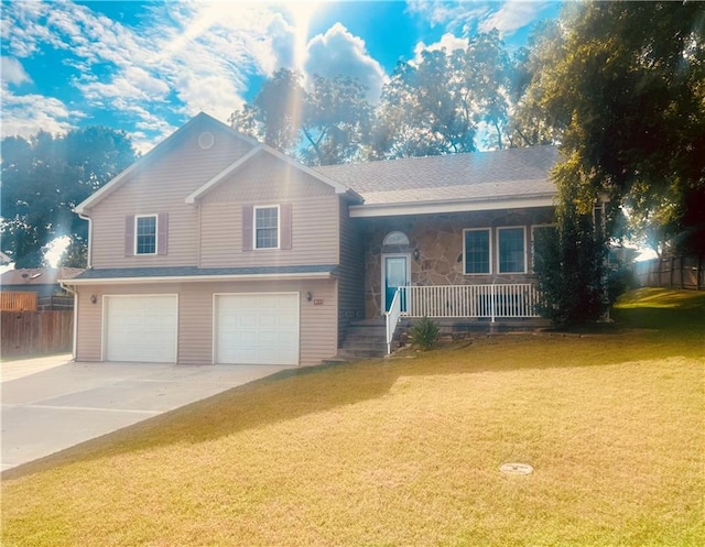 tri-level home featuring a front yard and a garage