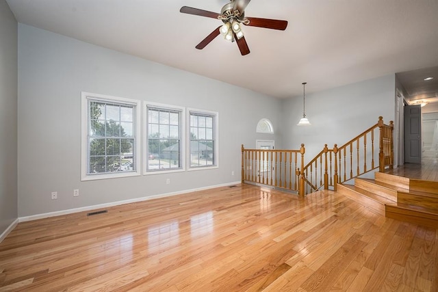 spare room featuring light hardwood / wood-style flooring and ceiling fan