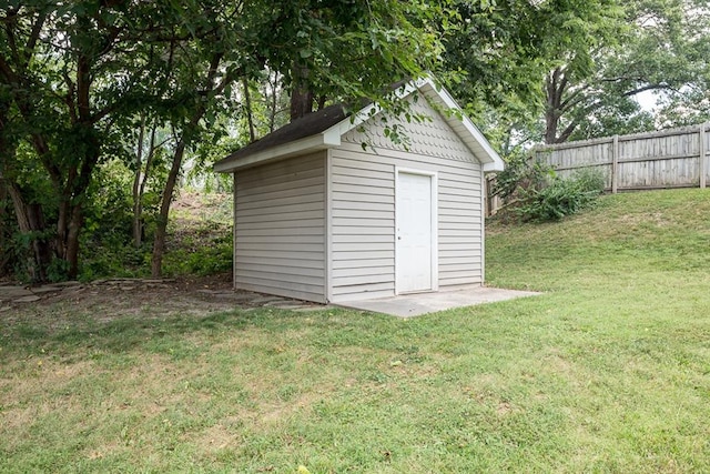 view of outbuilding with a lawn