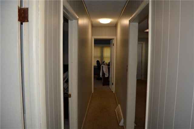 hallway featuring carpet and visible vents