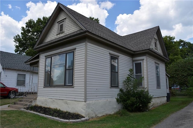 view of home's exterior featuring a shingled roof