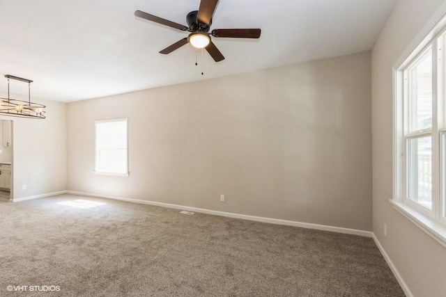 carpeted empty room with ceiling fan