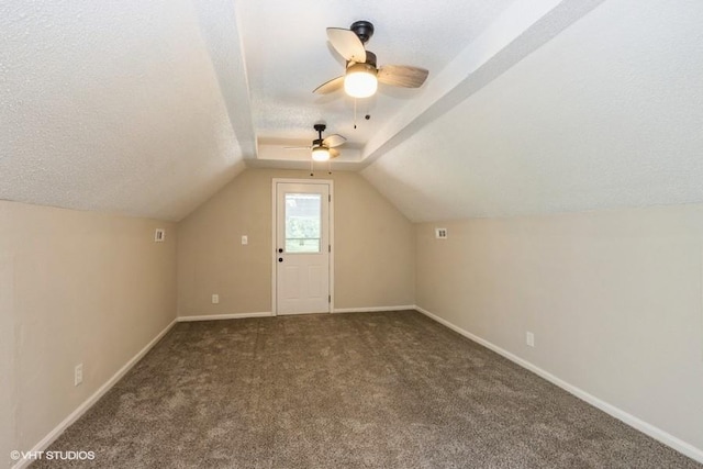 bonus room featuring lofted ceiling, ceiling fan, and carpet floors