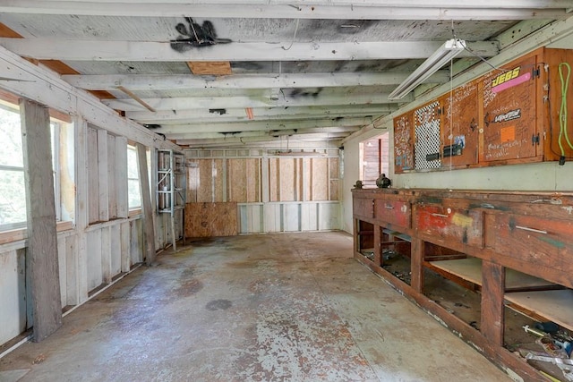 1040 Stone Ave, Independence, MO 64055 - miscellaneous room featuring a workshop area and concrete floors