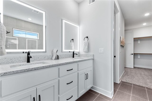 bathroom featuring vanity and tile patterned flooring