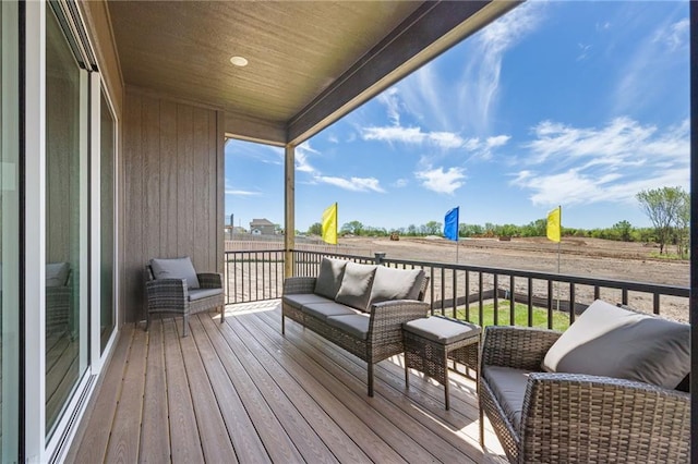 wooden terrace featuring outdoor lounge area