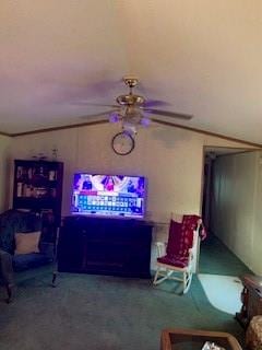 living room featuring ceiling fan and carpet