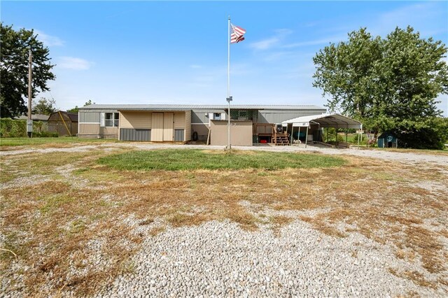 view of front of home featuring a carport