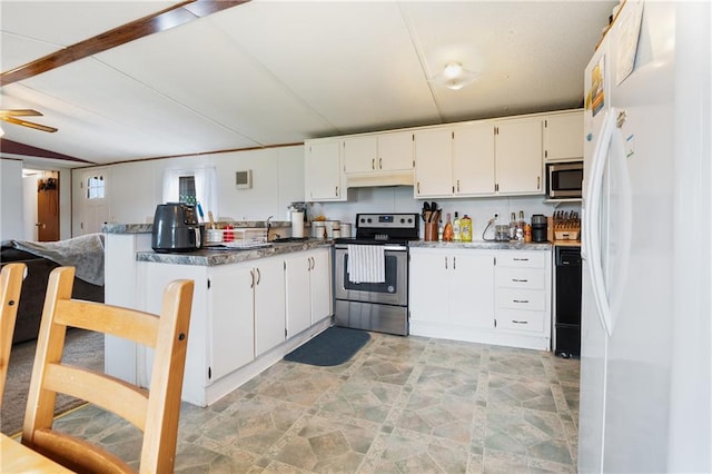 kitchen featuring white cabinets, a peninsula, stainless steel appliances, under cabinet range hood, and a sink