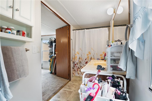 bathroom with a shower with shower curtain