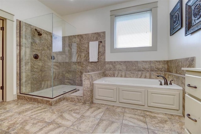 bathroom featuring tile patterned floors and independent shower and bath