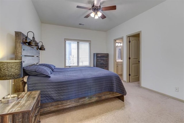 bedroom with carpet, ensuite bath, and ceiling fan