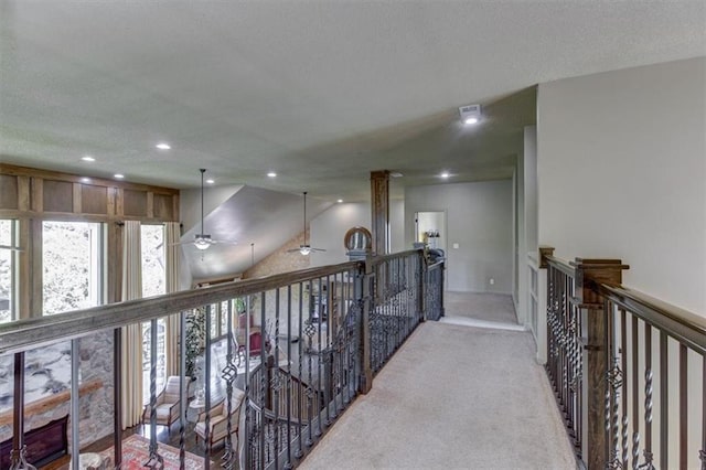 hall featuring light colored carpet