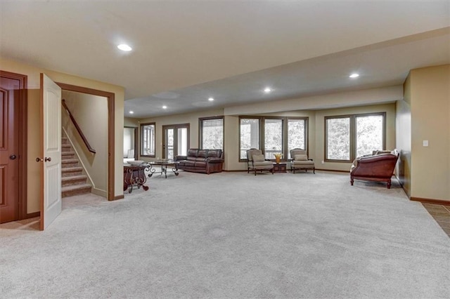 unfurnished living room featuring light colored carpet