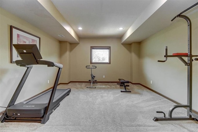 exercise area featuring light carpet