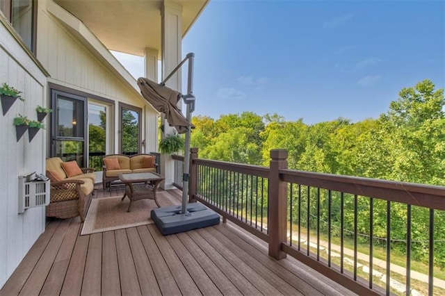 wooden deck featuring outdoor lounge area