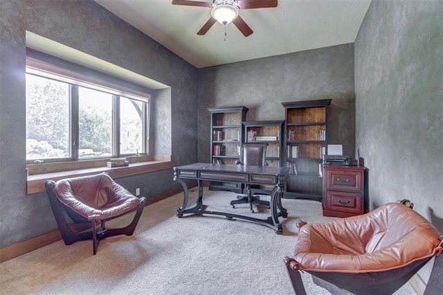 carpeted office with ceiling fan