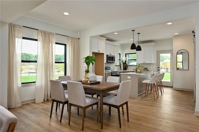 dining room with light wood-type flooring