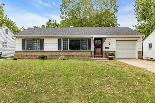 single story home featuring a garage and a front yard